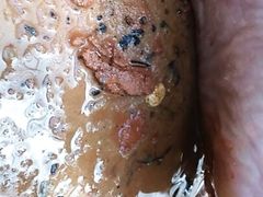 Pink painted toes on red wet dirt,the juxtaposition makes like not hurt. camera shaky cause balance comes in spurts love