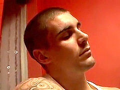 Thug jock Evan Heinze massaging socks in foot fetish solo