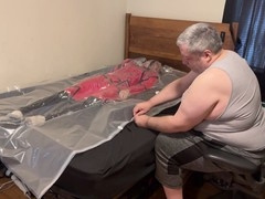 VacPacked in my long red raincoat with PVC aprons and pinkish PVC balls