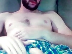 Bearded guy shows his huge hung flaccid cock in shorts