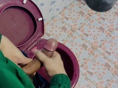 Amateur gay man jerks off in street food shop toilet