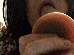 Brunette crossdresser deepthroat dildo