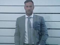 Gorgeous hunk in a suit strips and shows off that amazing body