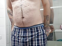 Hairy man masturbates before shower