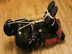 Hogtied in a straitjacket