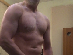 Muscle Parent bodybuilder works out nude shrugs, leaks precum, ripples and blows a load