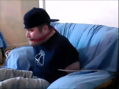 im tied up on the arm chair, gagged and barefoot