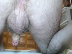 Oiled up and completely naked. Not even socks. Showing you everything and masturbating.