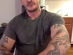 tattooed muscular hunk stroking off his big cock