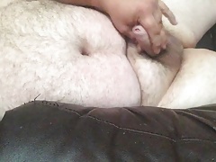 Uncut Bear Naked on the couch cumming
