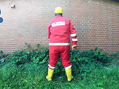 Worker Pup pawing off in red and yellow workgear