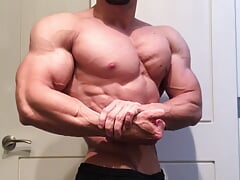 Jacked bodybuilder Benji Bastian flexing his huge, shredded, muscles