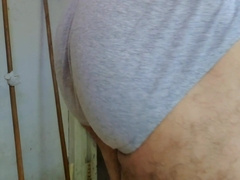 Klaus Joe showcases his nude back while fondling himself thru his lingerie