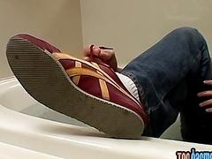 Gay guy massages his feet and masturbates in a jacuzzi
