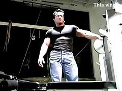 Muscle stud with pierced nipples oiling his body