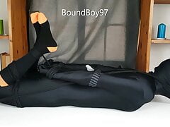 Lycra Guy hogtied on table.