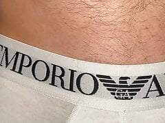 Tattooed stud oiling up monster cock through underwear