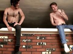 Straight studs pull their cocks out to jerk off together