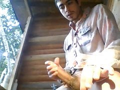 jacking a load out of a thick uncut cock outside