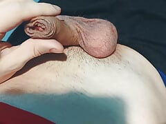 The guy plays with his balls and dick