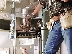 HVAC dad working on customer's heater