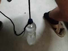 Slave Jo - CBT: 1.5 kilo bottle on his balls