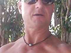 Muscular daddy jerking off in the public park