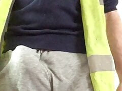 Scally builder's bulge in grey sweatpants and hi vis