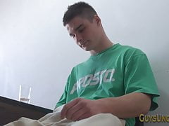 Buff hunk pulls foreskin and tugs cock