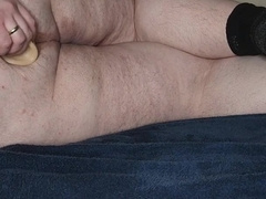 Chub laying down toying with fake penises