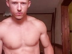 Russian athletic boy posing in his room