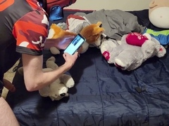 Cute twink plays with plushie while watching gay porn and indulging in self-pleasure