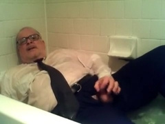 pants shirt and tie and shoes and socks in tub with cum