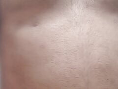Horny man pinching his nipples with clips