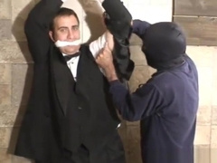 Tuxedo clad man bound gagged blindfolded and stripped