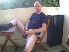 Man Outside On The Balcony Eating Lunch Undress And Starts Wanking His Penis Is Soon Erect And He Is Naked As He Wanks