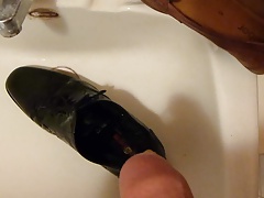 Piss in men's dress shoe