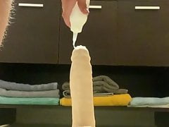 Boy playing with big dildo