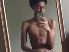 pretty boy with curly hair and a big cock rubbing his dick