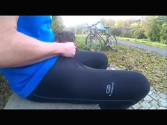 Young pissing and wanking in black lycra in public park