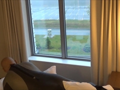 Silicone Hooded Wetsuited Stud Gets Super-Naughty at Motel Window and Porks his Pillows