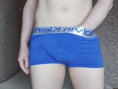 Fit jock strokes his massive cock to porn and shoots his load