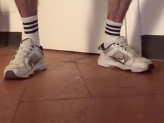 wooly man in sneakers and white socks faps off and showcases his gams