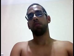 Horny guy with glasses shows off his juicy dick and ass