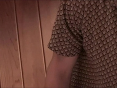 Super-cute viewing of pornography on the smartphone under the grimacing of the lollipop