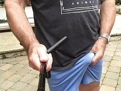 commando in thin blue shorts outdoors