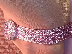 My feet close up looking in shiny glossy pantyhose and sexy pink heels sandals.