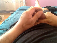 Gay guy passionately strokes his huge cock