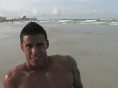 Handsome hot bodybuilder beach