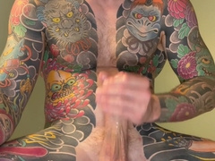 Inked fellow strokes and blows giant fountain